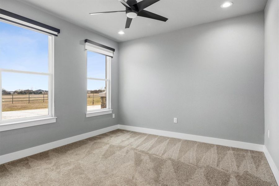 Unfurnished room featuring a ceiling fan, light carpet, and recessed lighting