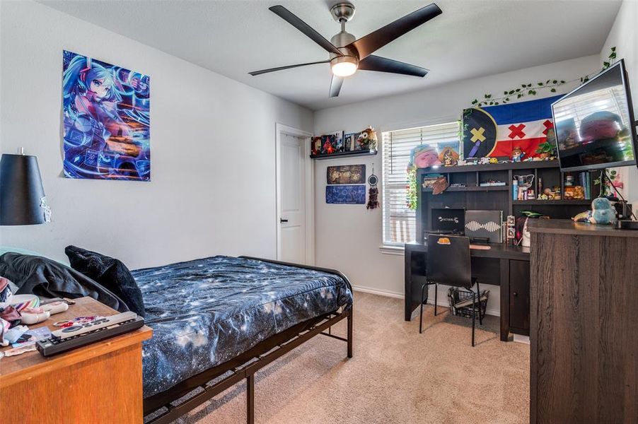 Bedroom featuring carpet floors and ceiling fan