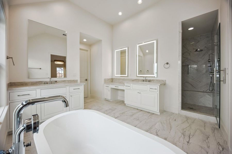 The primary bath also has an oversized glass-enclosed shower.