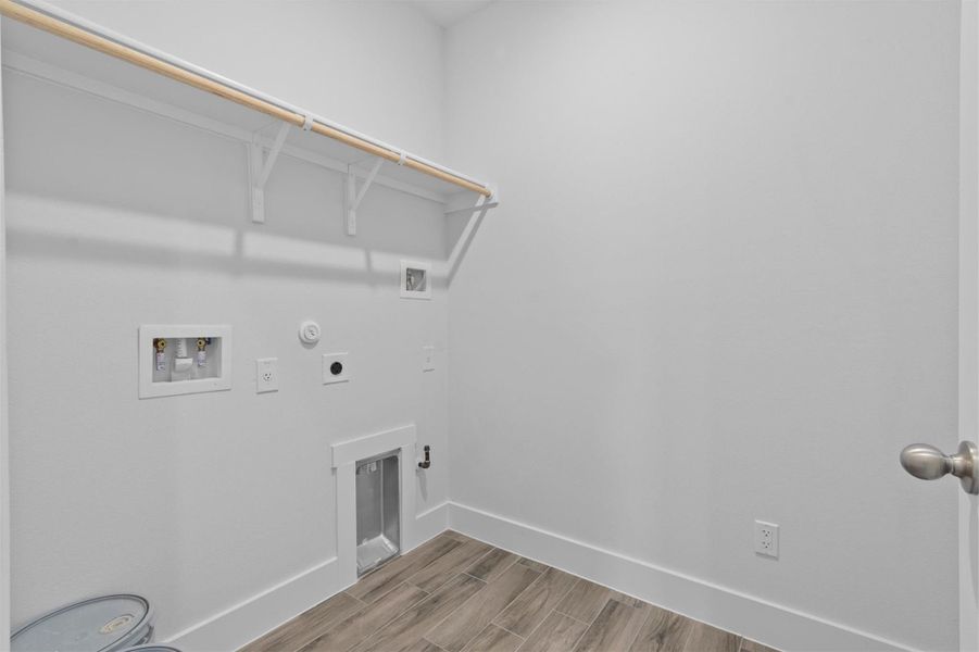 Clothes washing area featuring washer hookup, gas dryer hookup, and hookup for an electric dryer