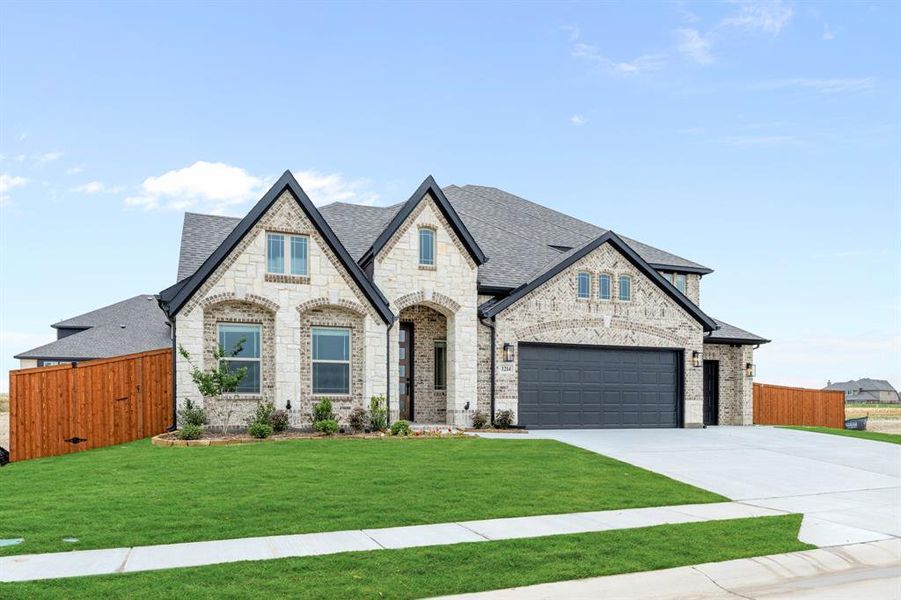 Front exterior of a new home in Timberbrook, Justin, TX, highlighting curb appeal (Image 2). Front exterior of a new home in Timberbrook, Justin, TX, highlighting curb appeal (Image 2).