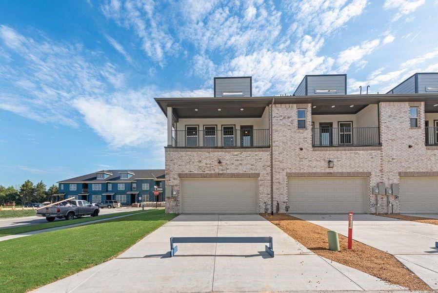 Front exterior of a new home in Bayside, Rowlett, TX, highlighting curb appeal (Image 20).