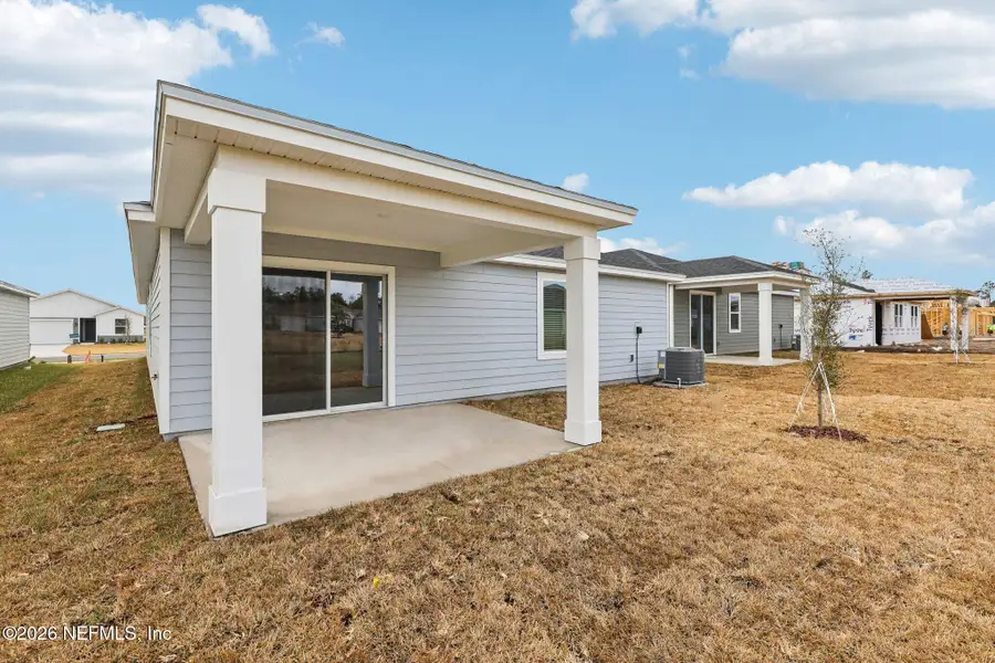 Exterior details and patio area of a home in Cypress Meadows - Signature Series, Jacksonville (Image 3).