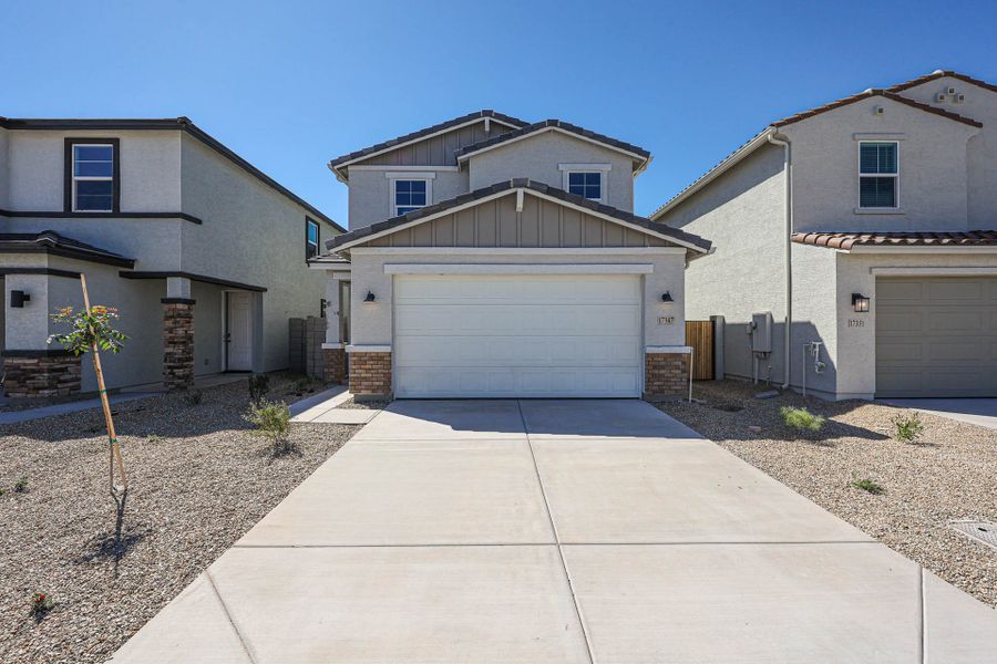 A driveway leading to a house. A driveway leading to a house.