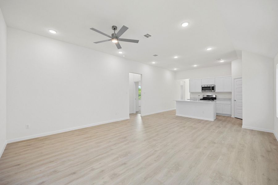 Living and Dining Area in the Cypress home plan by Trophy Signature Homes - REPRESENTATIVE PHOTO