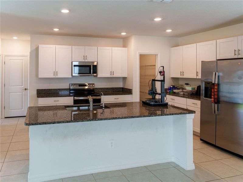 Furnished interior view inside a new home in The Isle of Avalon, Spring Hill (Image 6).