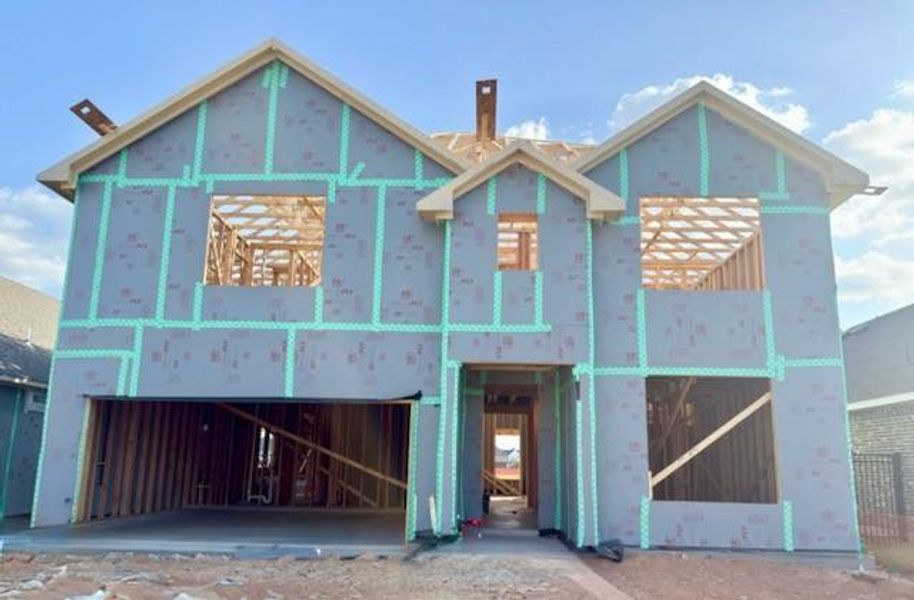 In-progress construction of a new home in Sunterra, Katy, TX (Image 18).