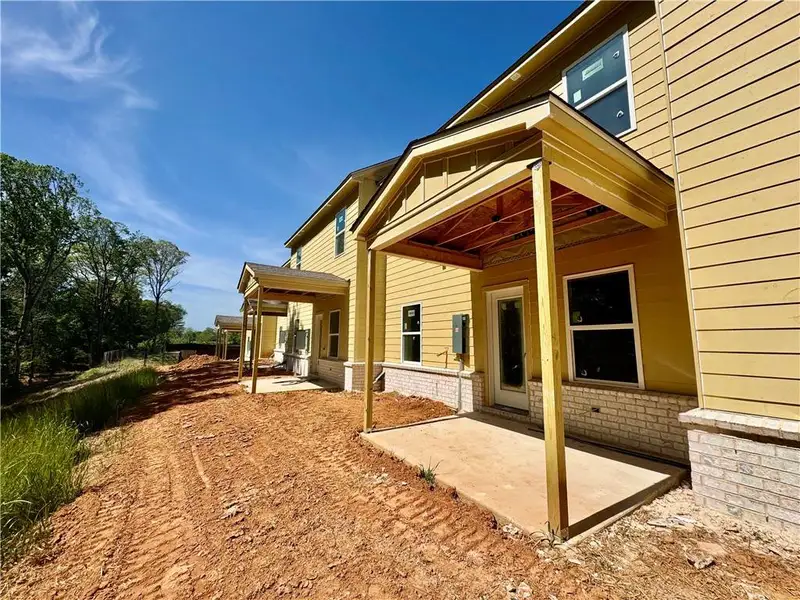 Exterior details and patio area of a home in Eastlyn Crossing, Flowery Branch (Image 4).