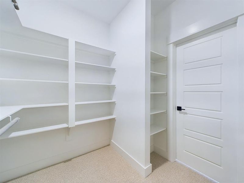 Spacious primary closet.