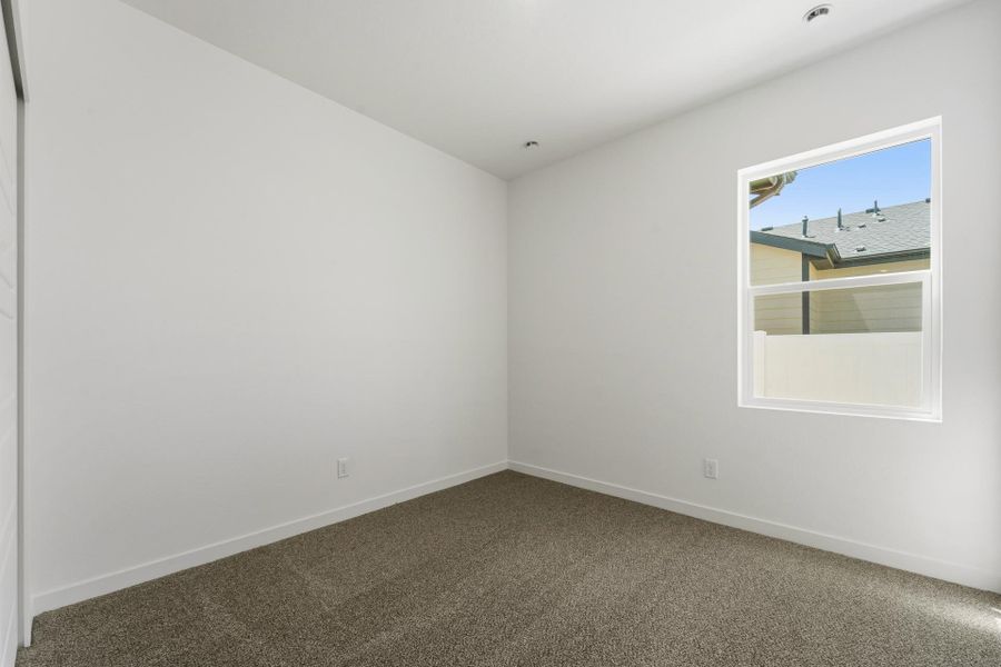 Spacious, unfurnished interior of a new home in Union Colony West, Greeley (Image 49).