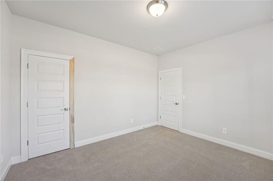 Spacious, unfurnished interior of a new home in Hemingway - Highland Series, Cumming (Image 52).