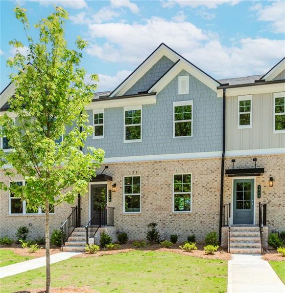 Front exterior of a new home in Hillcrest Landing, Sugar Hill, GA, highlighting curb appeal (Image 27). Front exterior of a new home in Hillcrest Landing, Sugar Hill, GA, highlighting curb appeal (Image 27).