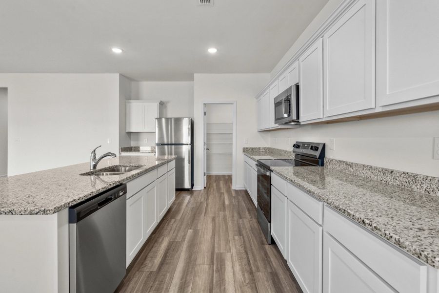 Representative furnished interior of a home built from the Europa by Starlight Homes in Oakfield Lakes, Parrish (Image 8).