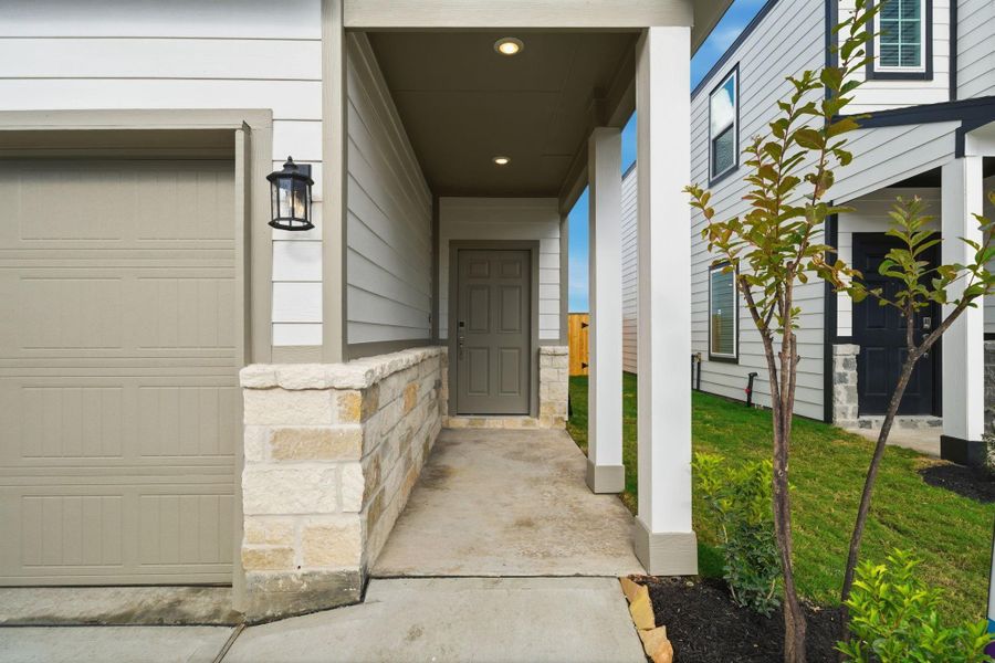 Exterior details and patio area of a home in Lakes at Black Oak, Magnolia (Image 3).
