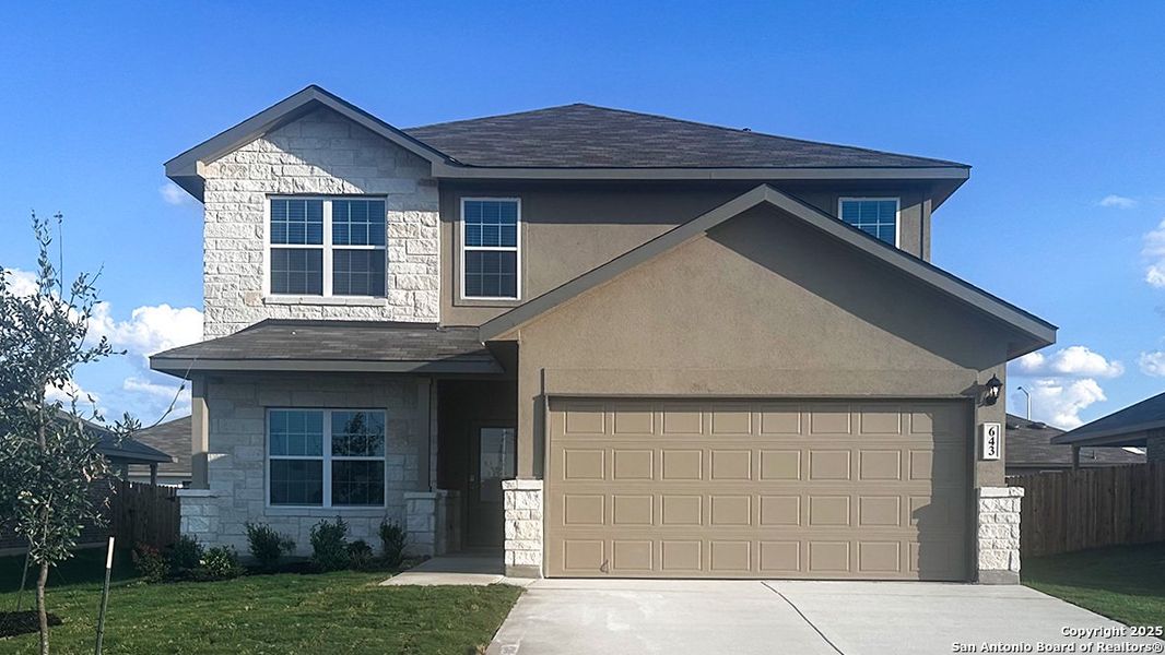 Front exterior of a new home in Steele Creek, Cibolo, TX, highlighting curb appeal (Image 2).