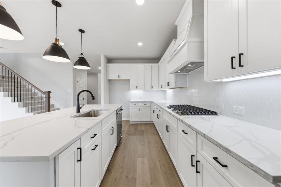 You'll enjoy a classic color palette, striking trim and modern stainless steel in this dream kitchen!
