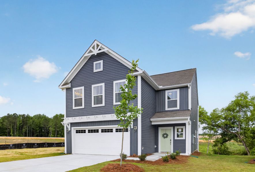 Front exterior of a new home in White Oak Creek Crossing, Angier, NC, highlighting curb appeal (Image 2).
