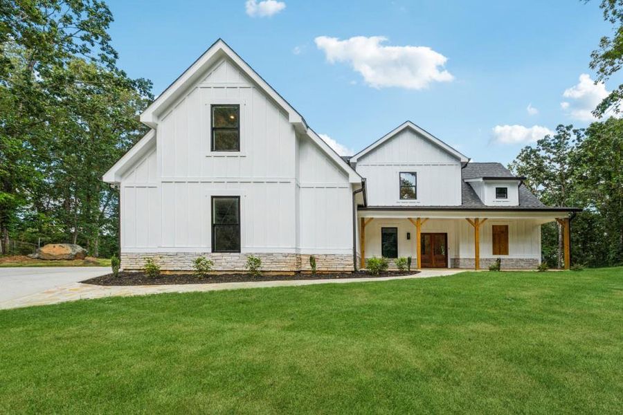 Front exterior of a new home in , Woodstock, GA, highlighting curb appeal (Image 27).