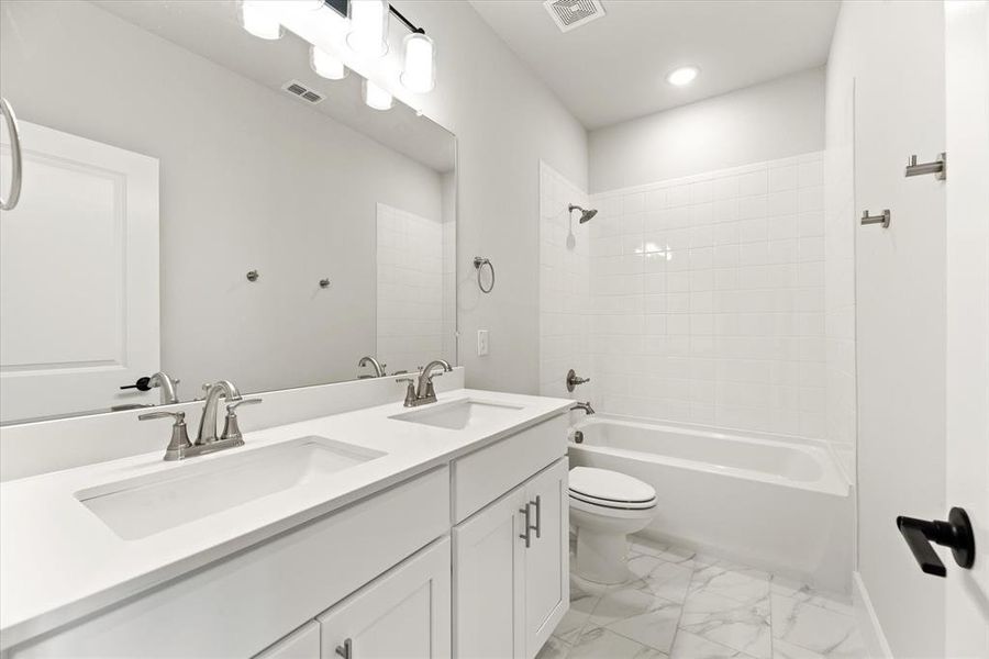 Guests will enjoy their own space in this lovely guest bath!