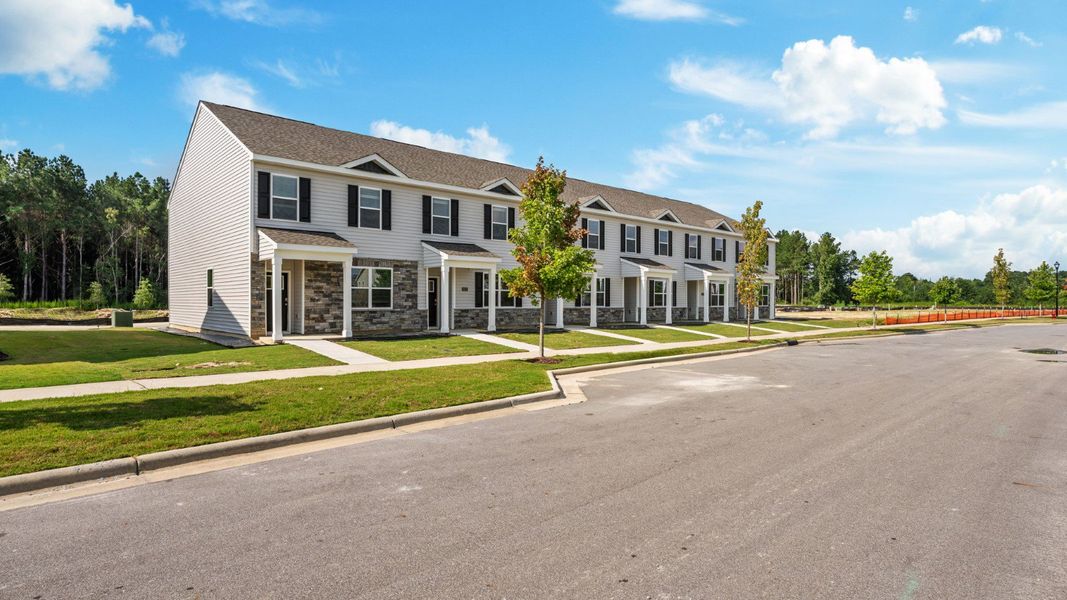 Front exterior of a new home in Clock Road Townhomes, New Bern, NC, highlighting curb appeal (Image 22).