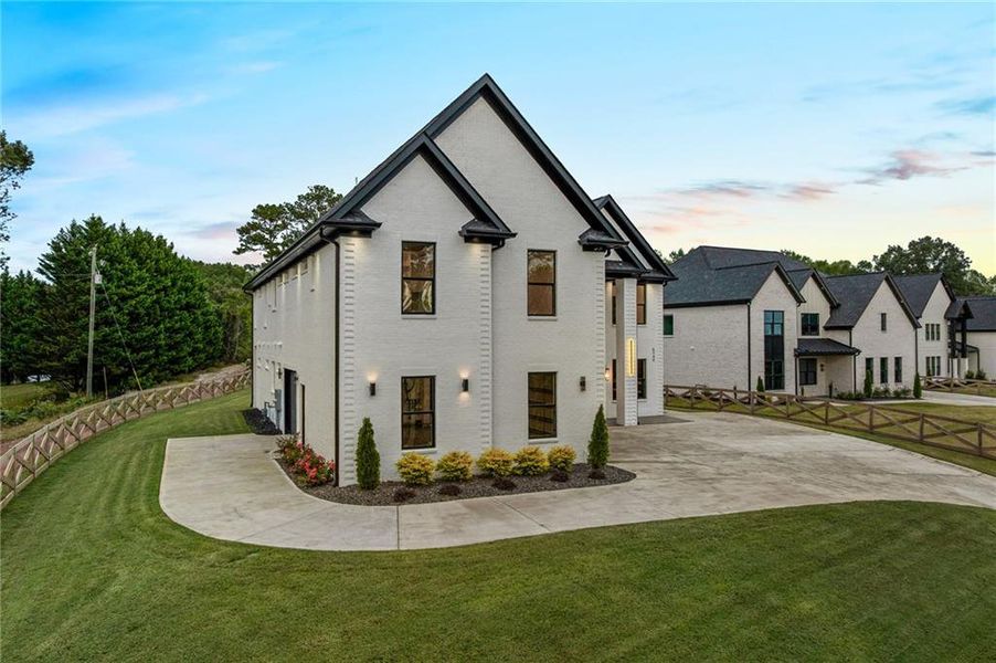 Front exterior of a new home in , Braselton, GA, highlighting curb appeal (Image 26). Front exterior of a new home in , Braselton, GA, highlighting curb appeal (Image 26).