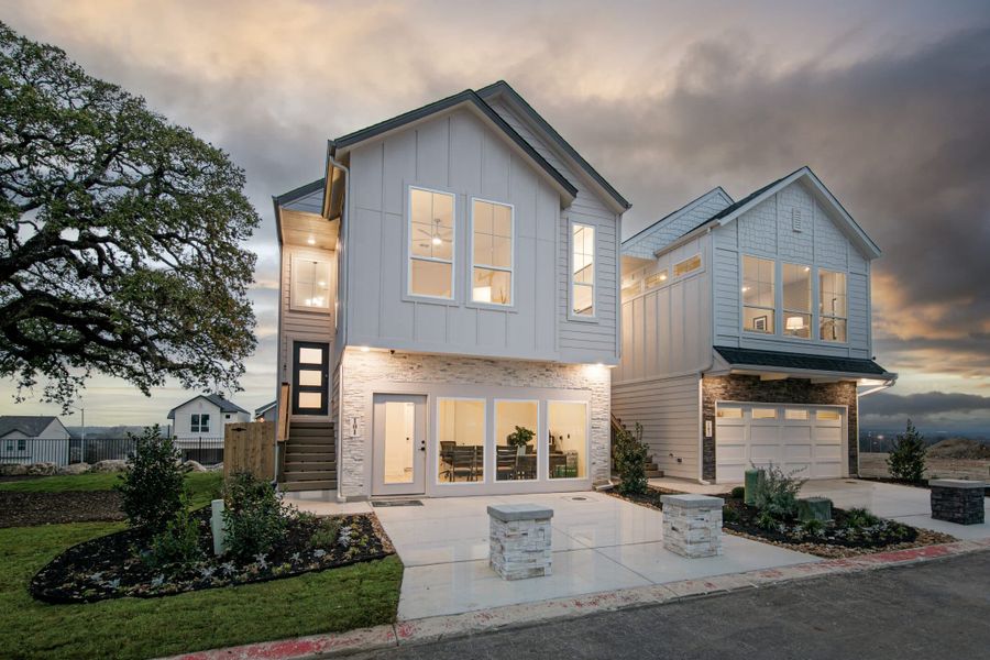 Front exterior of a new home in Santa Rita Ranch, Liberty Hill, TX, highlighting curb appeal (Image 23). Front exterior of a new home in Santa Rita Ranch, Liberty Hill, TX, highlighting curb appeal (Image 23).