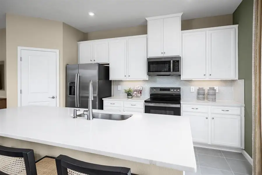 Furnished interior view inside a new home in Pine Pointe at Astonia, Davenport (Image 3).