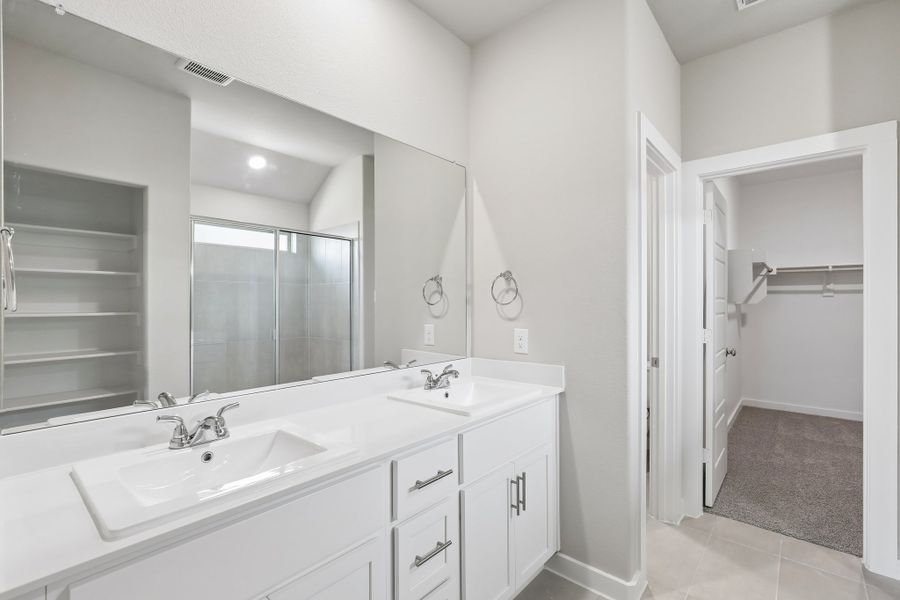 Primary Bathroom in the Oscar home plan by Trophy Signature Homes