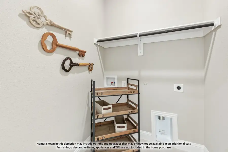 Walk-in closet with white shelving rod, wooden storage rack, and decorative key wall art Walk-in closet with white shelving rod, wooden storage rack, and decorative key wall art