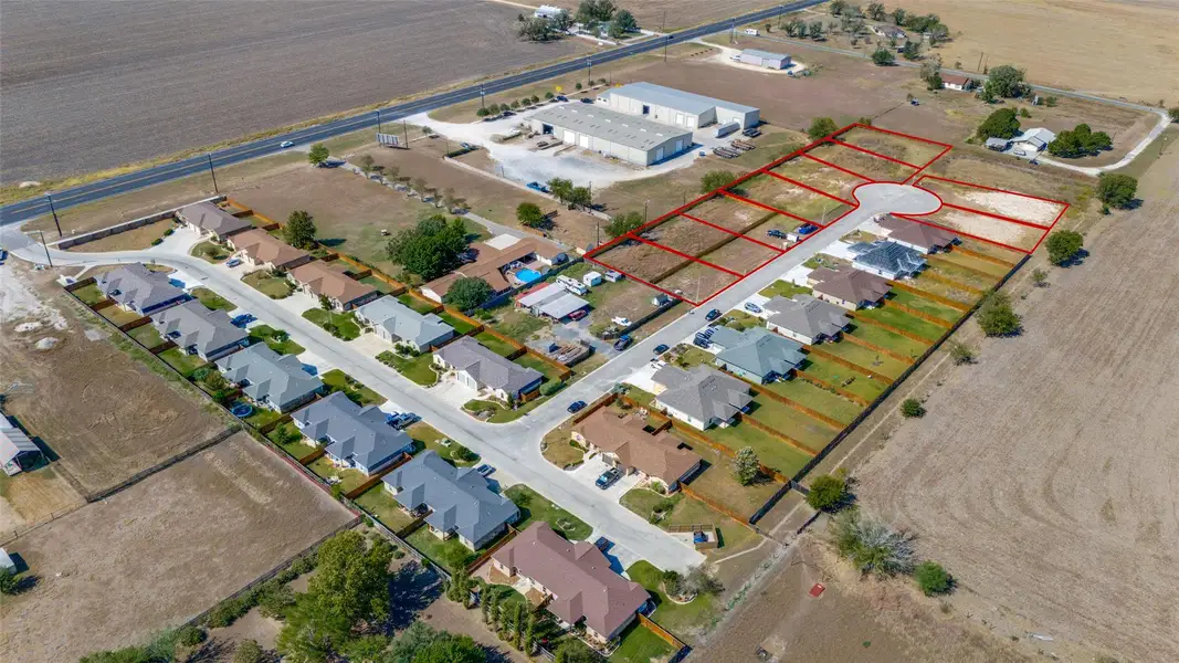 Aerial view of sparsely populated area featuring property parcel outlined