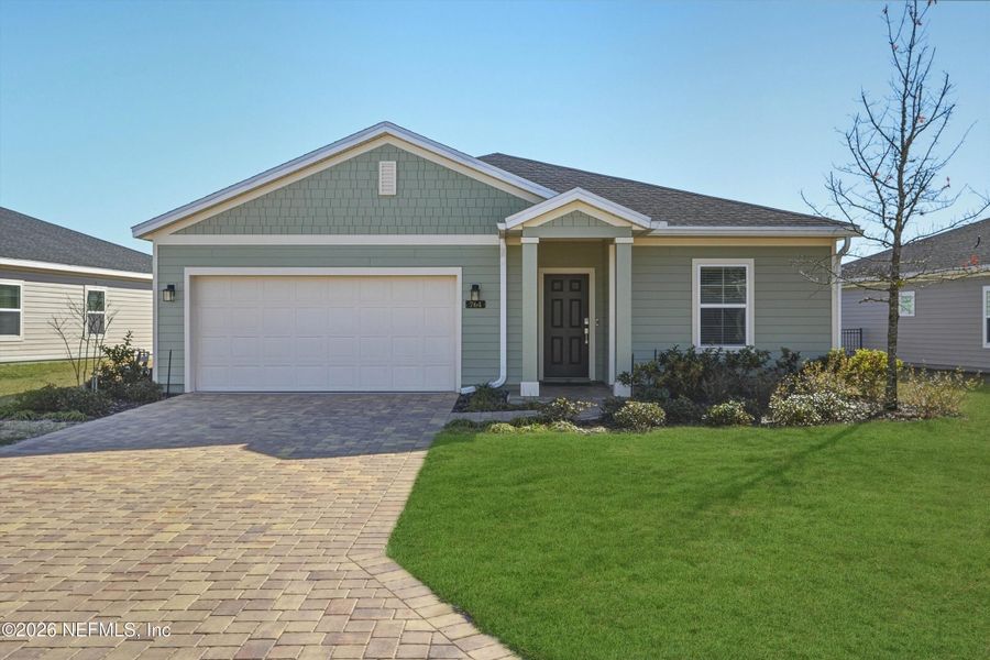 Front exterior of a new home in St Augustine Lakes, St. Augustine, FL, highlighting curb appeal (Image 27).