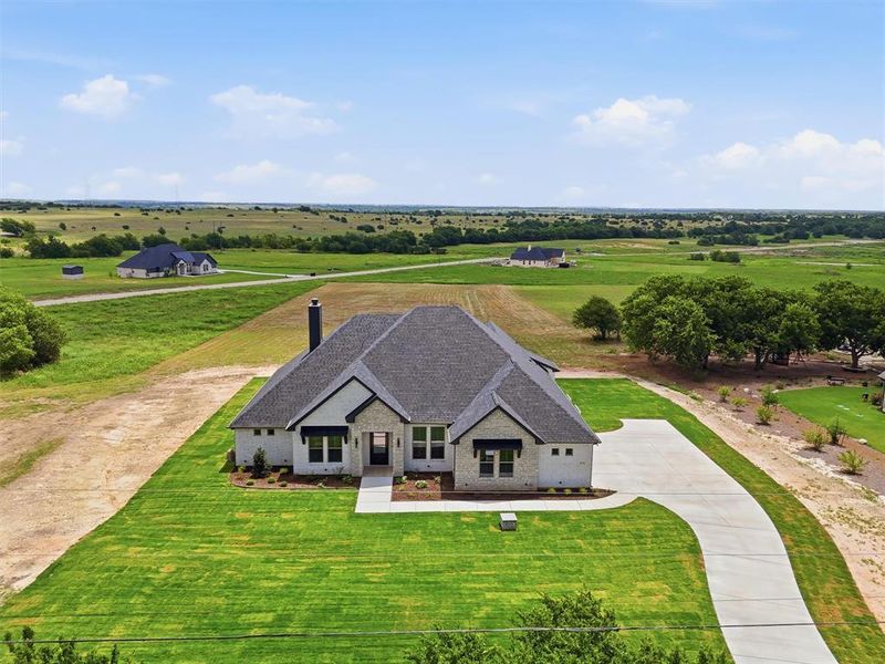 Front exterior of a new home in , Godley, TX, highlighting curb appeal (Image 2). Front exterior of a new home in , Godley, TX, highlighting curb appeal (Image 2).