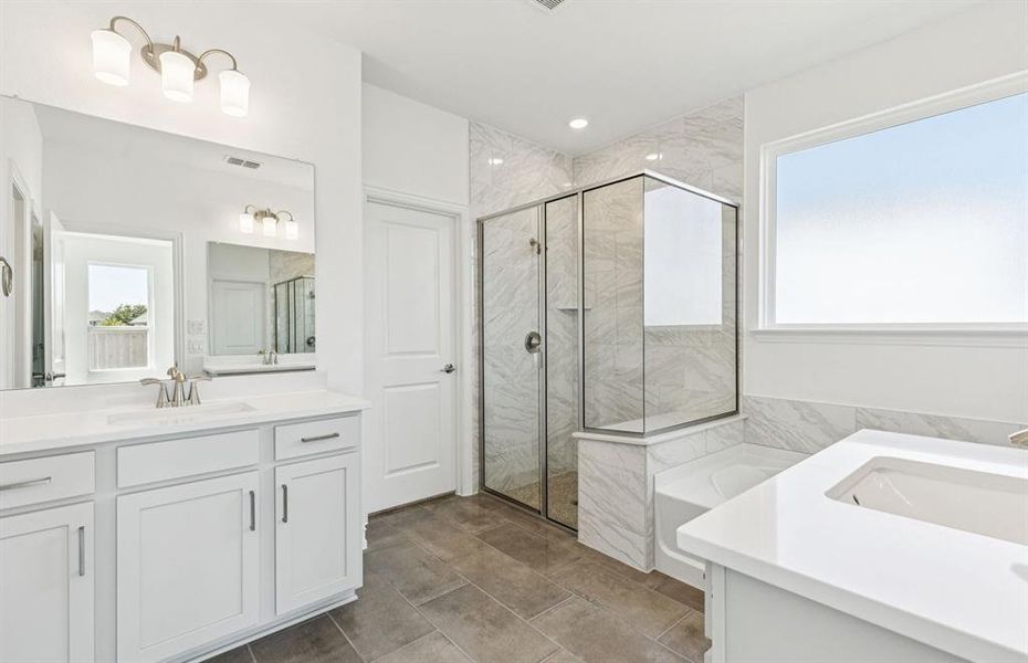 Luxurious owner's bath complete with double sinks and a generous shower Luxurious owner's bath complete with double sinks and a generous shower