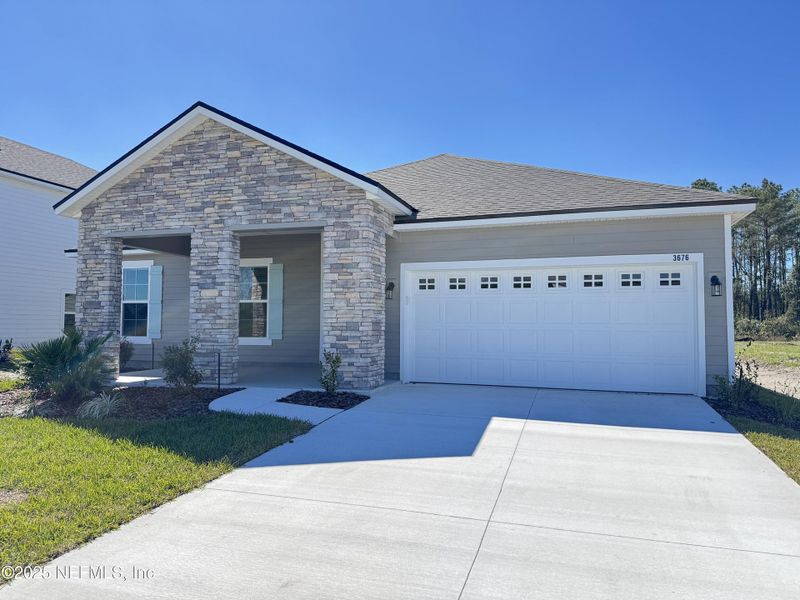 Front exterior of a new home in , Green Cove Springs, FL, highlighting curb appeal (Image 17).
