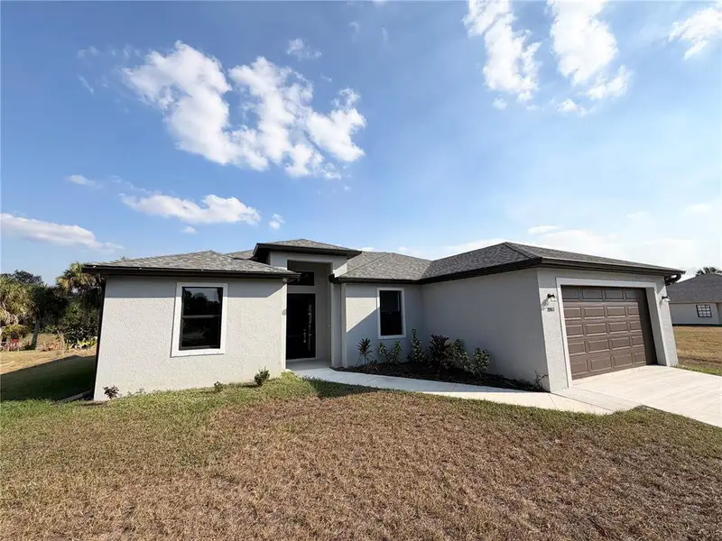 Front exterior of a new home in , North Port, FL, highlighting curb appeal (Image 2).