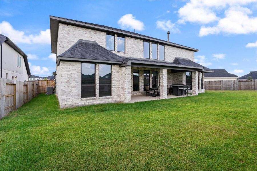 Expansive backyard with covered entertaining space
