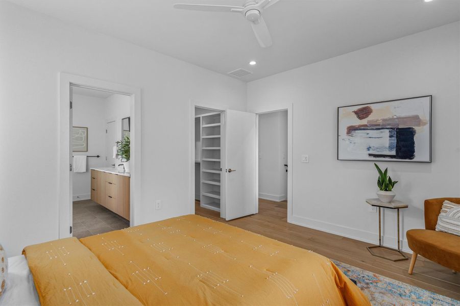 The spacious primary suite features a fab ensuite bathroom and a custom walk in closet. The spacious primary suite features a fab ensuite bathroom and a custom walk in closet.