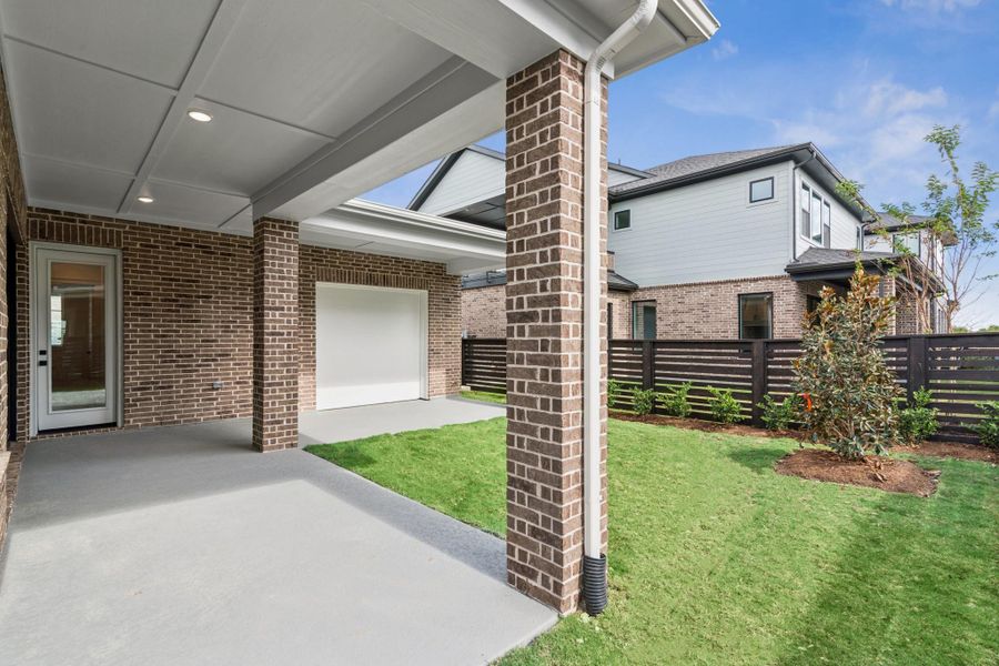 Exterior details and patio area of a home in Easthaven at Bridgeland Central - Vision Collection, Cypress (Image 15).
