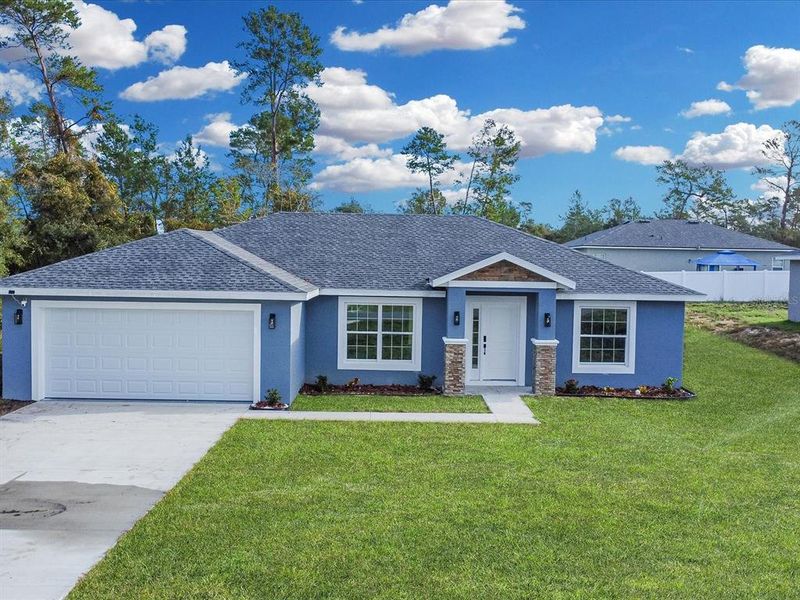 Front exterior of a new home in , Ocala, FL, highlighting curb appeal (Image 1). Front exterior of a new home in , Ocala, FL, highlighting curb appeal (Image 1).