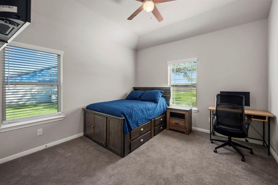 Second bedroom. All bedrooms are spacious and feature high vaulted ceilings with ceiling fans and plush carpet.