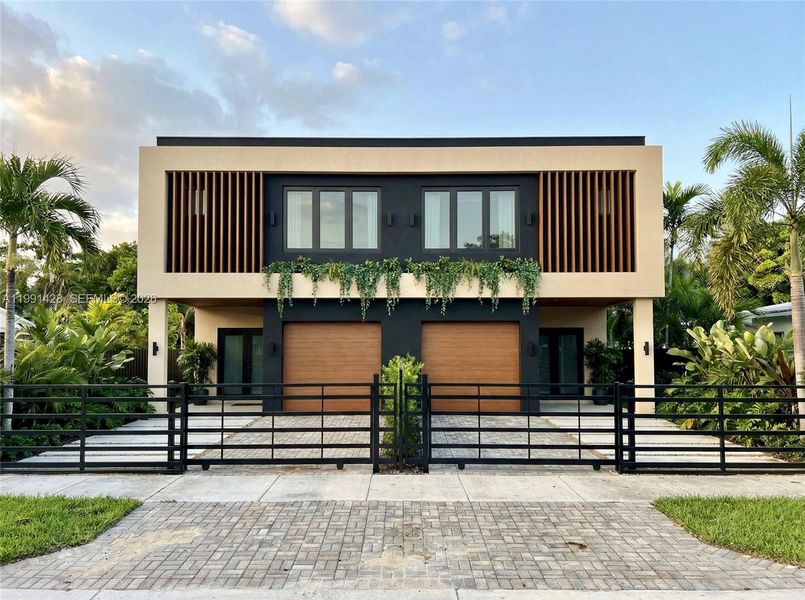 Front exterior of a new home in , Miami, FL, highlighting curb appeal (Image 1). Front exterior of a new home in , Miami, FL, highlighting curb appeal (Image 1).