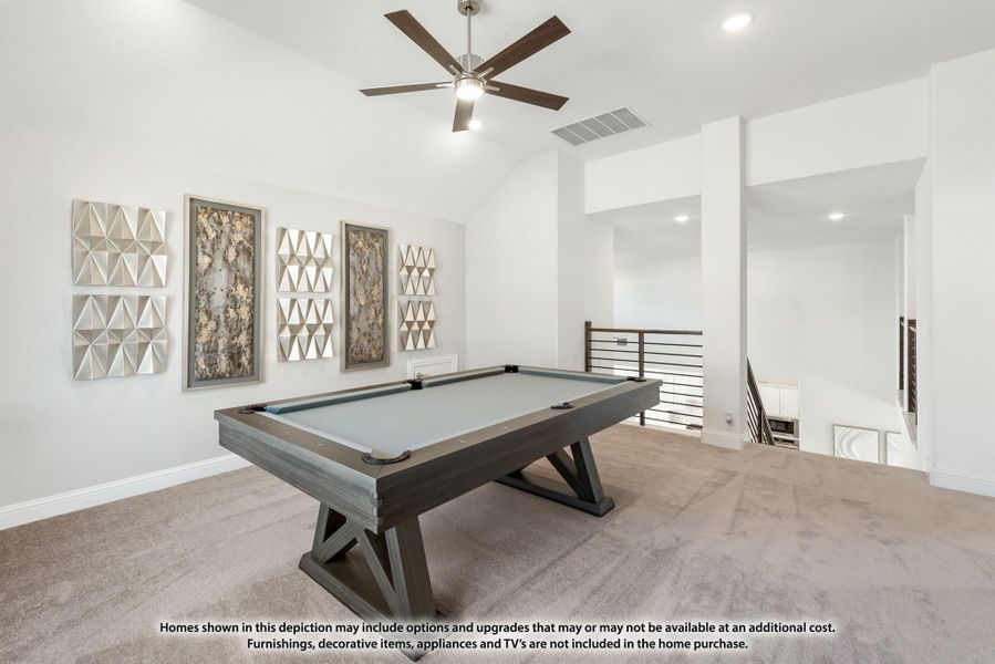 Game room with pool table, vaulted ceiling, ceiling fan, and carpet flooring on upper level Game room with pool table, vaulted ceiling, ceiling fan, and carpet flooring on upper level