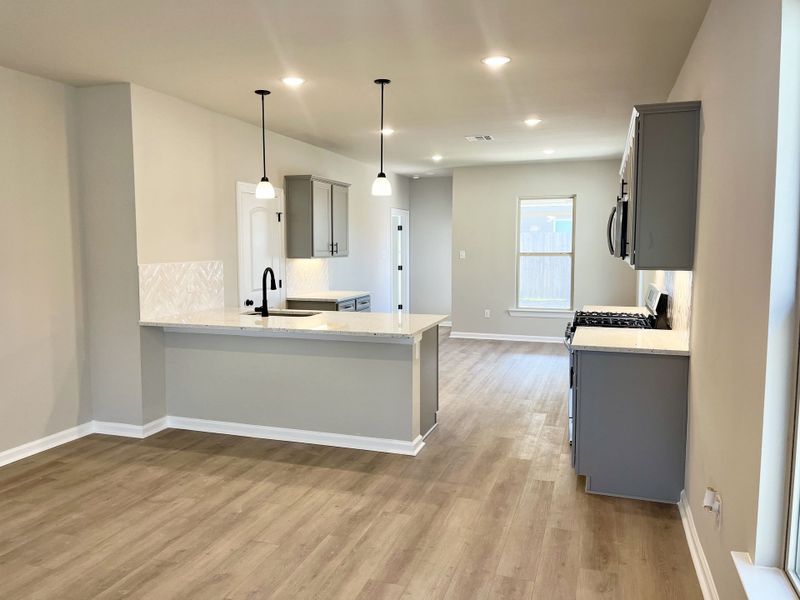 Front exterior of a new home in Emberly, Beasley, TX, highlighting curb appeal (Image 8).