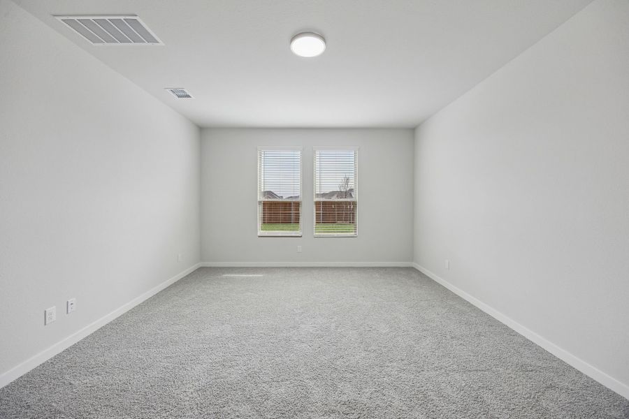 Primary Suite in the Masters home plan by Trophy Signature Homes – REPRESENTATIVE PHOTO