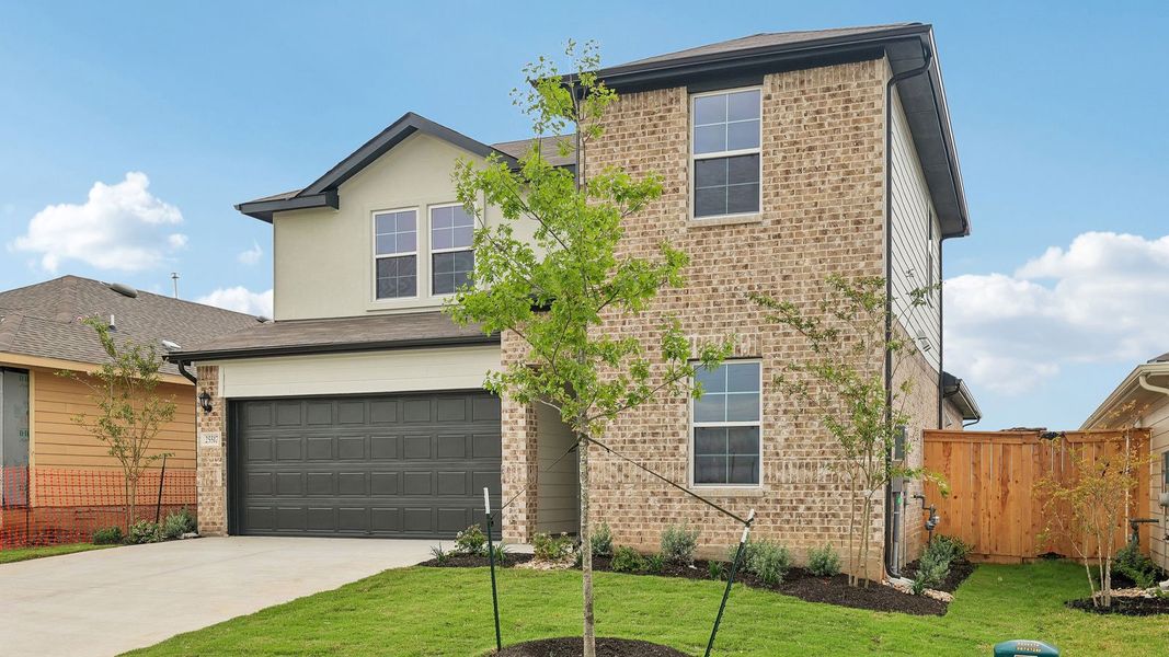 Front exterior of a new home in Briarwood, Elgin, TX, highlighting curb appeal (Image 18).