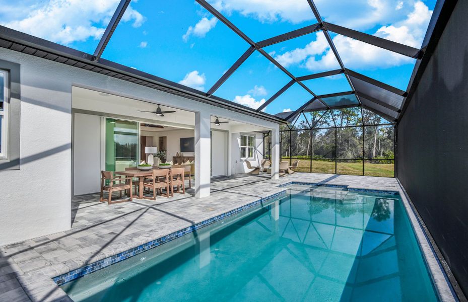 Exterior details and patio area of a home in Riverwood, Zephyrhills (Image 3).