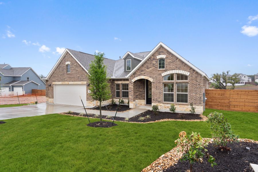 Representative exterior photo of a completed home built from the Palmer by Ashton Woods in The Estates at La Cima, San Marcos, TX (Image 23).