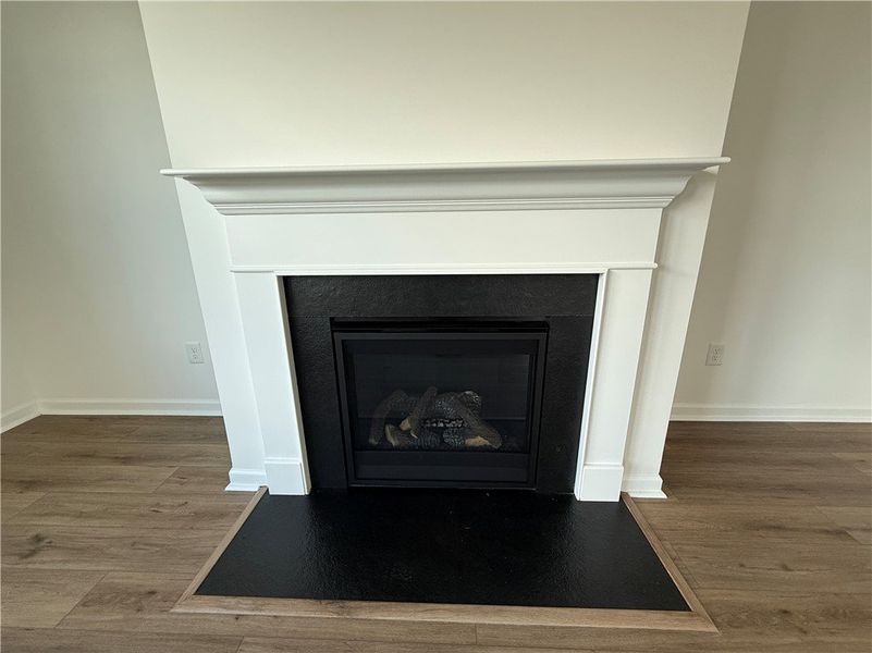 Elegant fireplace with a crisp white mantelpiece c Elegant fireplace with a crisp white mantelpiece c