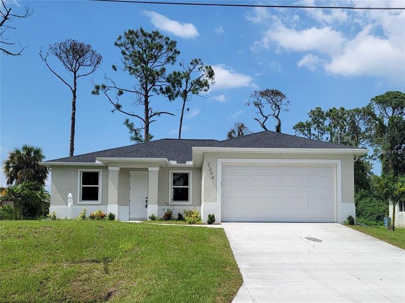 Front exterior of a new home in , North Port, FL, highlighting curb appeal (Image 21).
