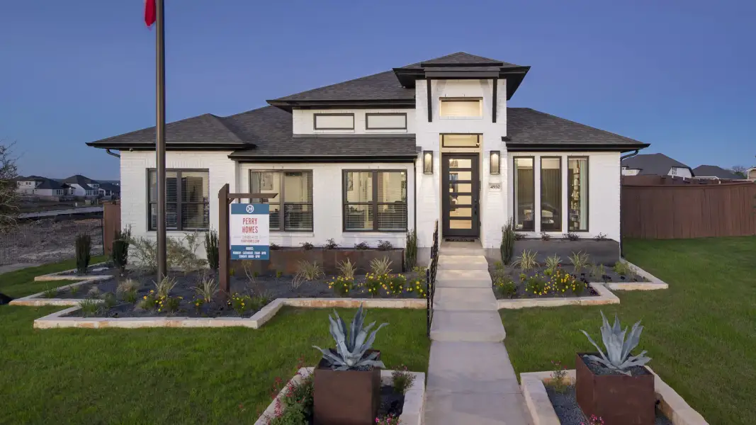 Front exterior of a new home in Mayfair, New Braunfels, TX, highlighting curb appeal (Image 21). Front exterior of a new home in Mayfair, New Braunfels, TX, highlighting curb appeal (Image 21).